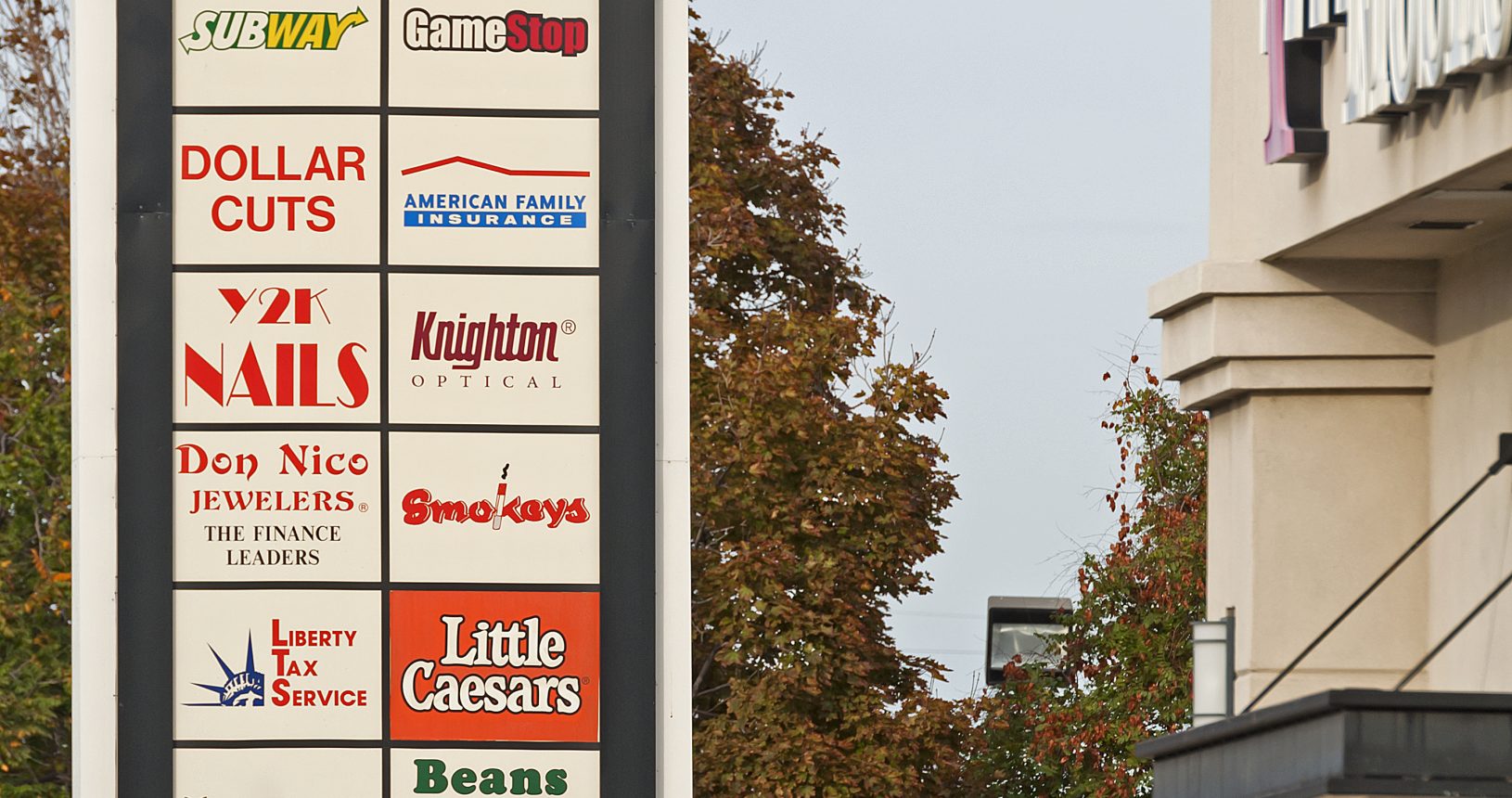 A sign with many different types of business signs.