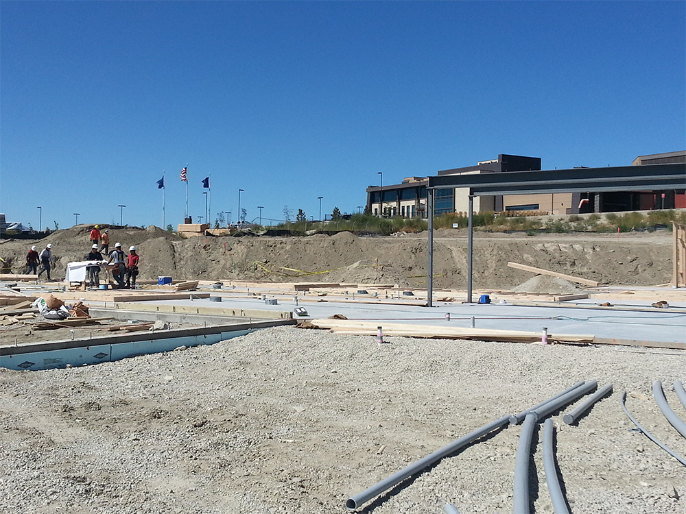 A construction site with people working on it.