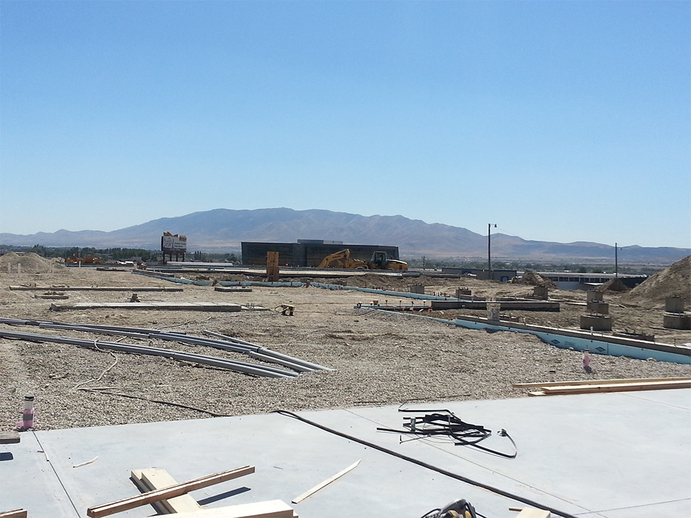 A construction site with mountains in the background.