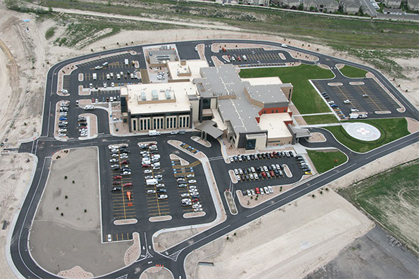 A large building with many cars parked in it.