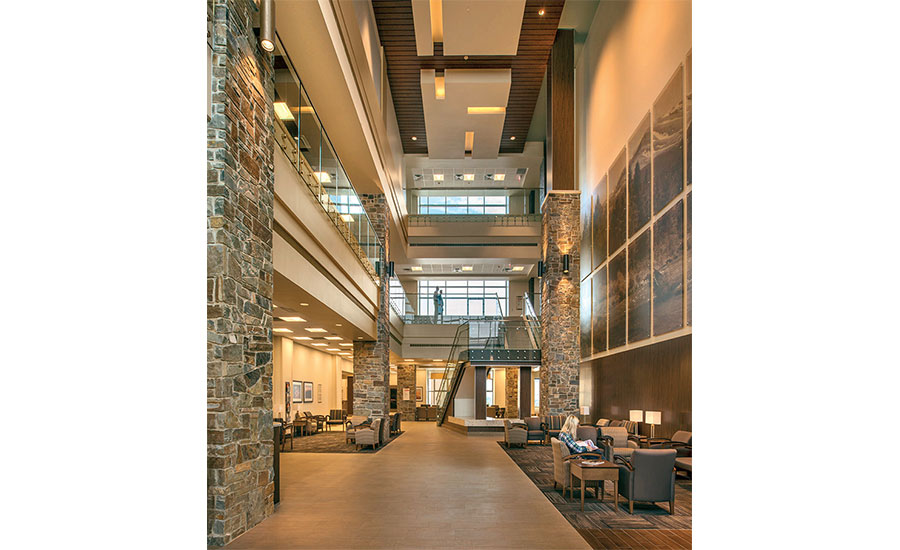 A large lobby with stone walls and floors.