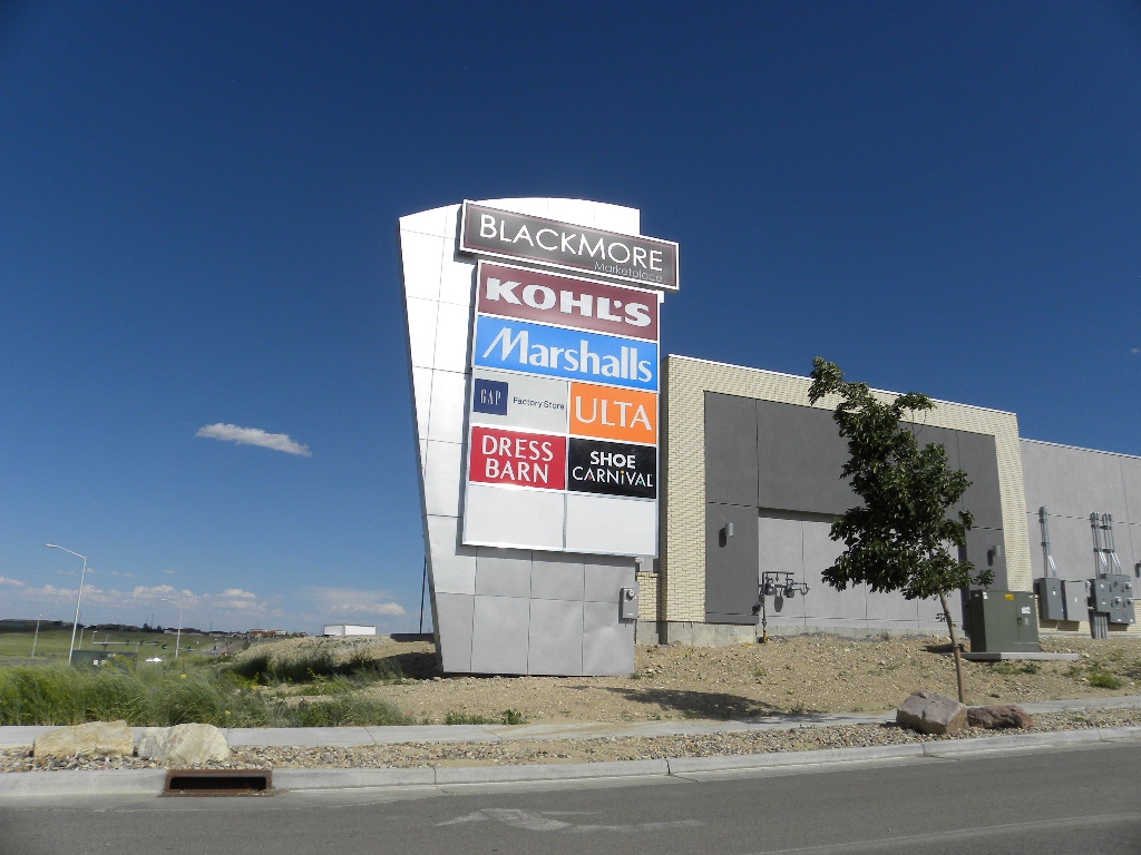 A large sign is on the side of a building.