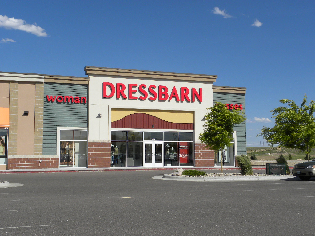 A store front of dressbarn in the middle of a street.