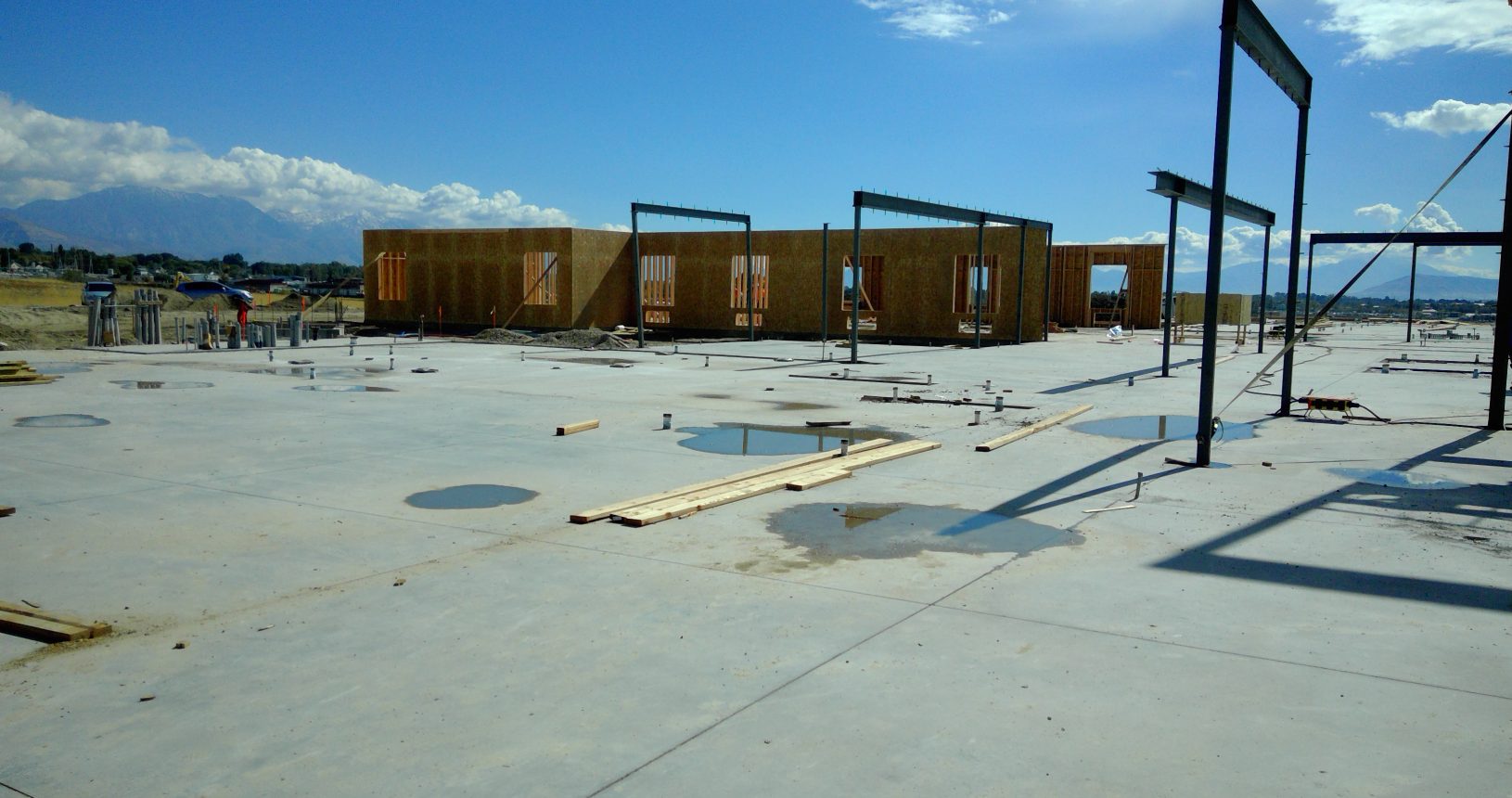 A building under construction with some wooden frames.