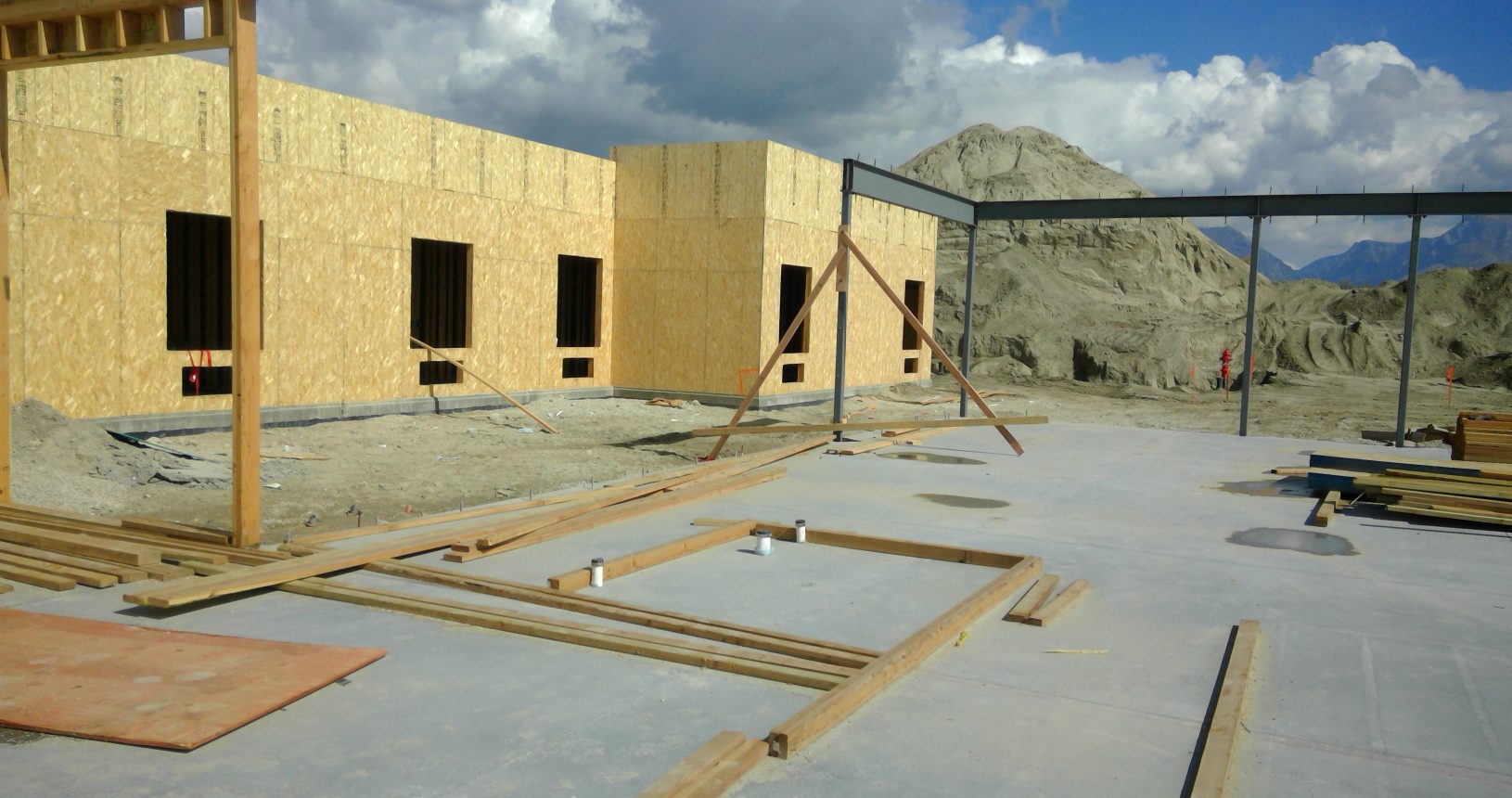 A building under construction with some wooden frames