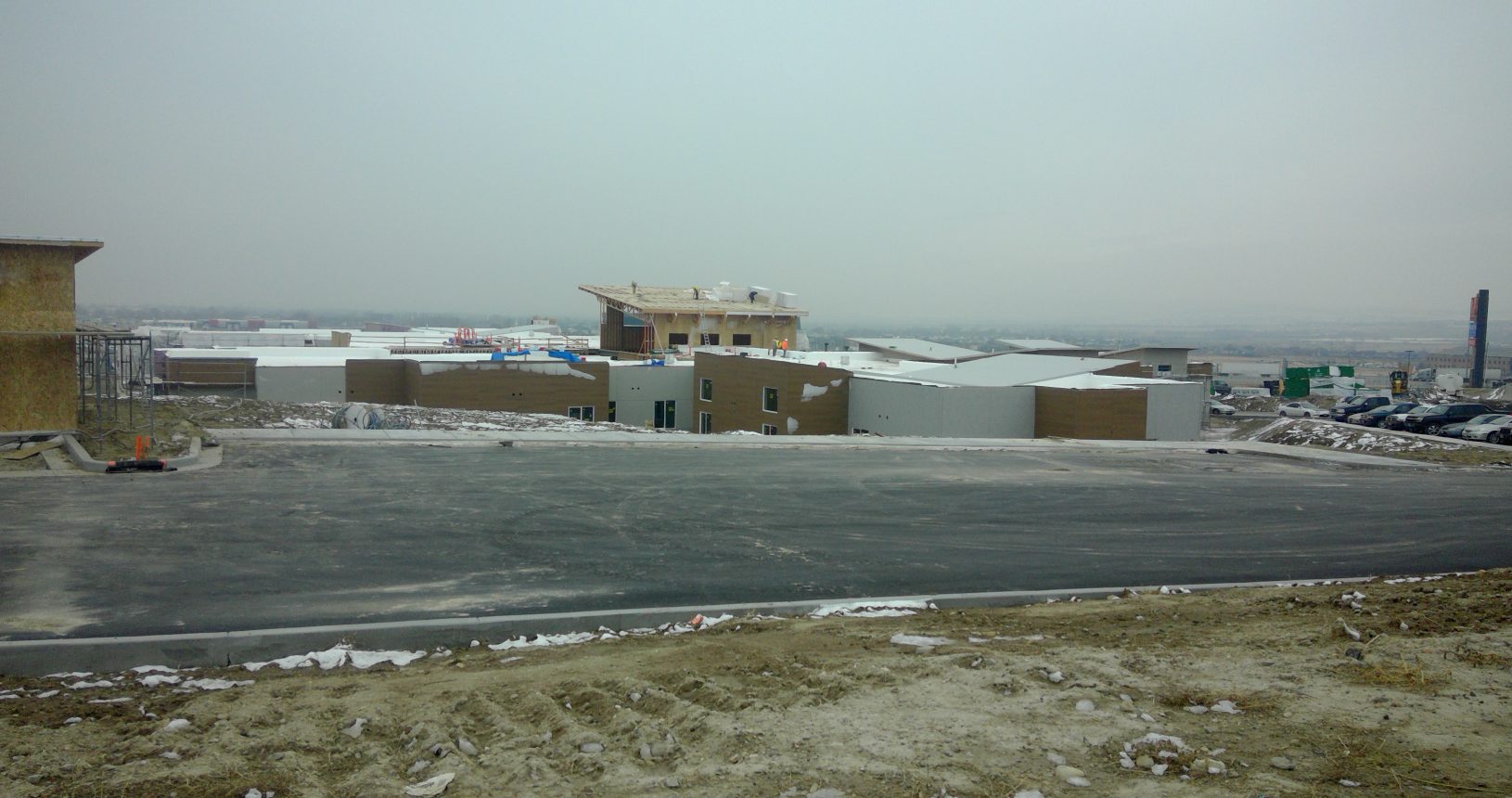 A large building with snow on the ground