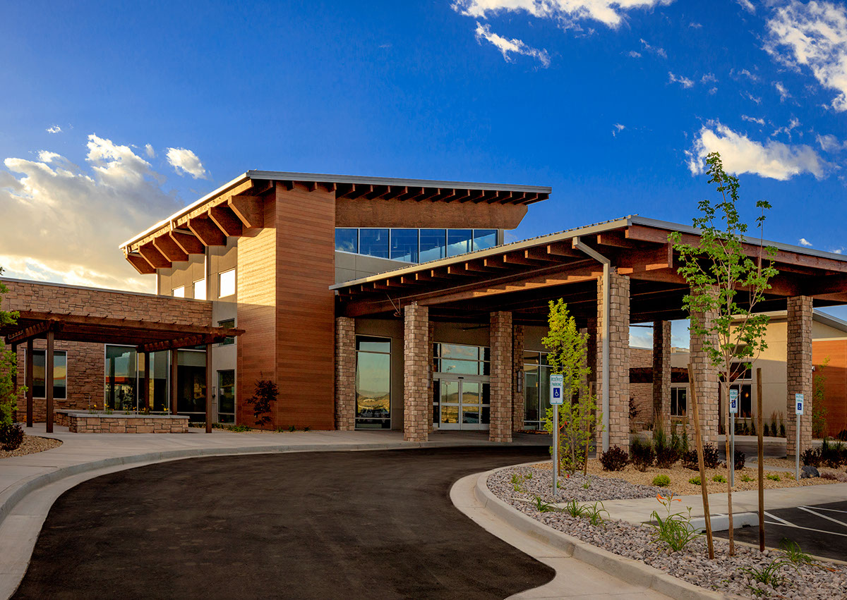 A building with a large driveway in front of it.