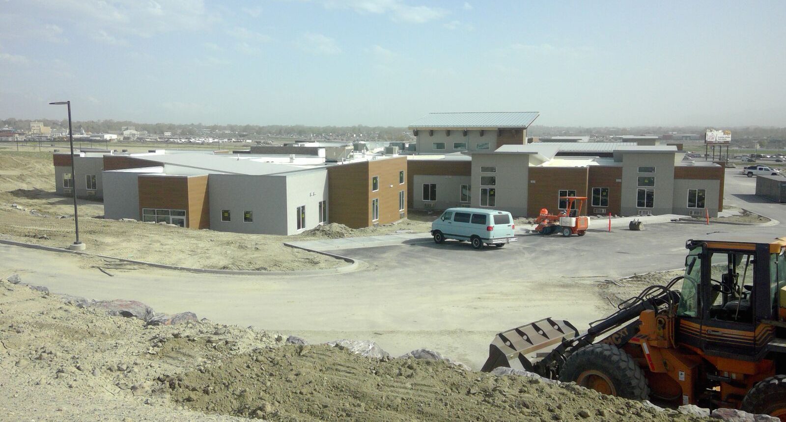 A van parked in the middle of a construction site.