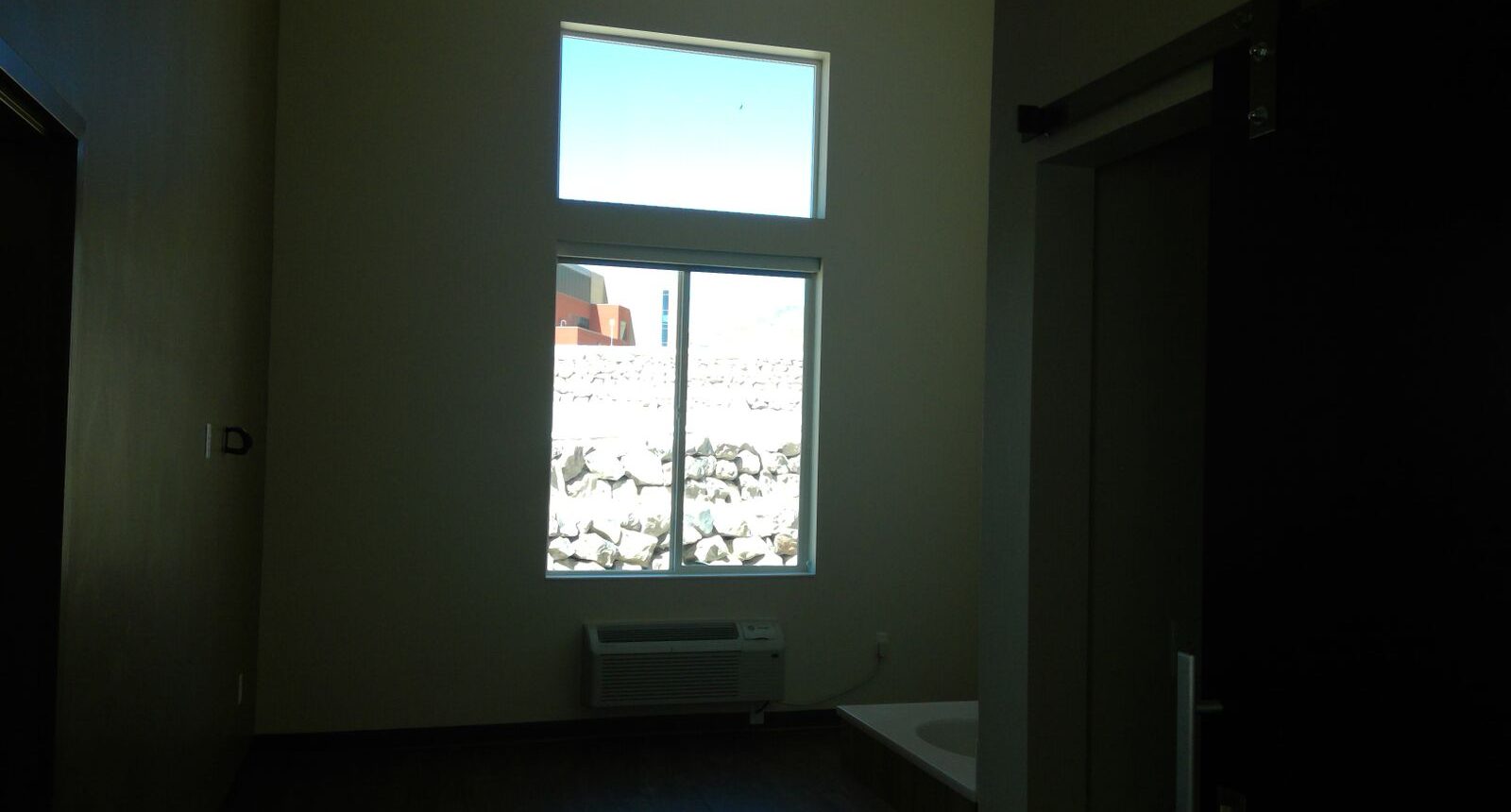 A room with a window and a door