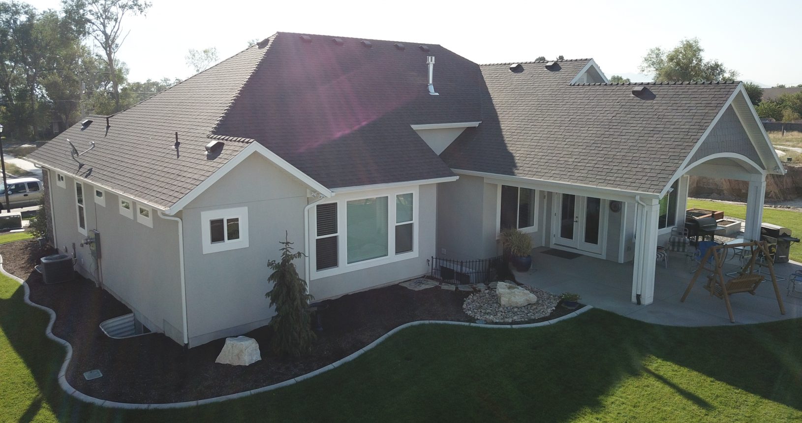 A house with a large yard and a lawn.